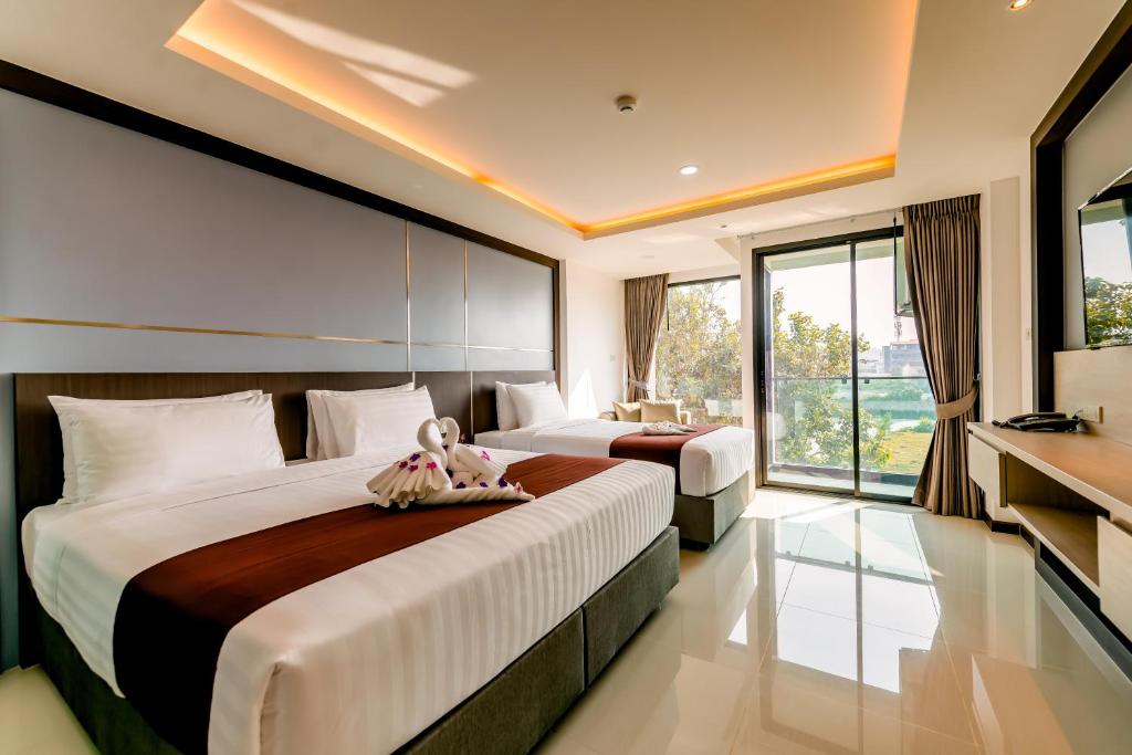 Двухместный (Двухместный номер Делюкс с 2 отдельными кроватями) отеля The Proud Hotel Pattaya, Паттайя