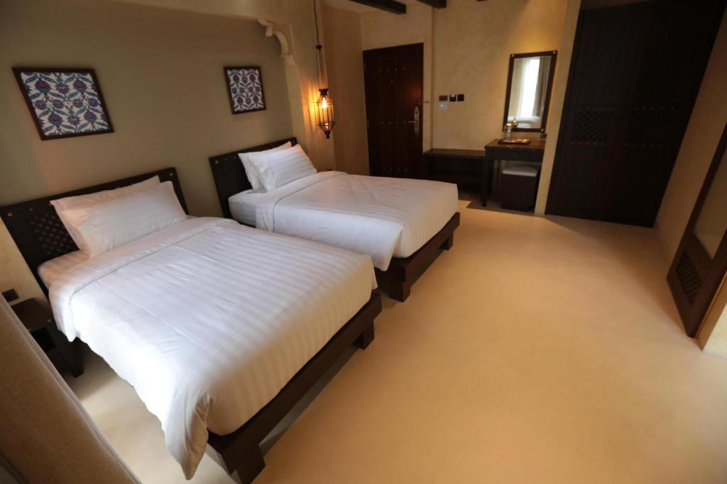 Двухместный (Улучшенный двухместный номер с 2 отдельными кроватями) отеля Dewan Bangkok, Бангкок