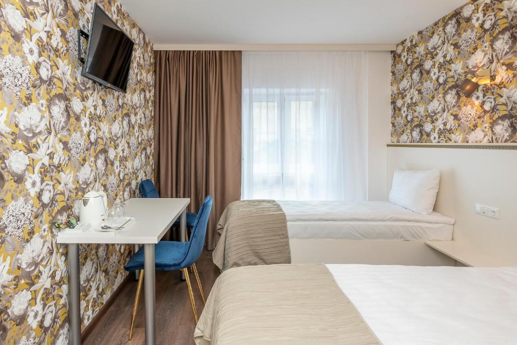 Двухместный (Стандартный двухместный номер с 2 отдельными кроватями) отеля Kesminta Old Town Hotel, Вильнюс