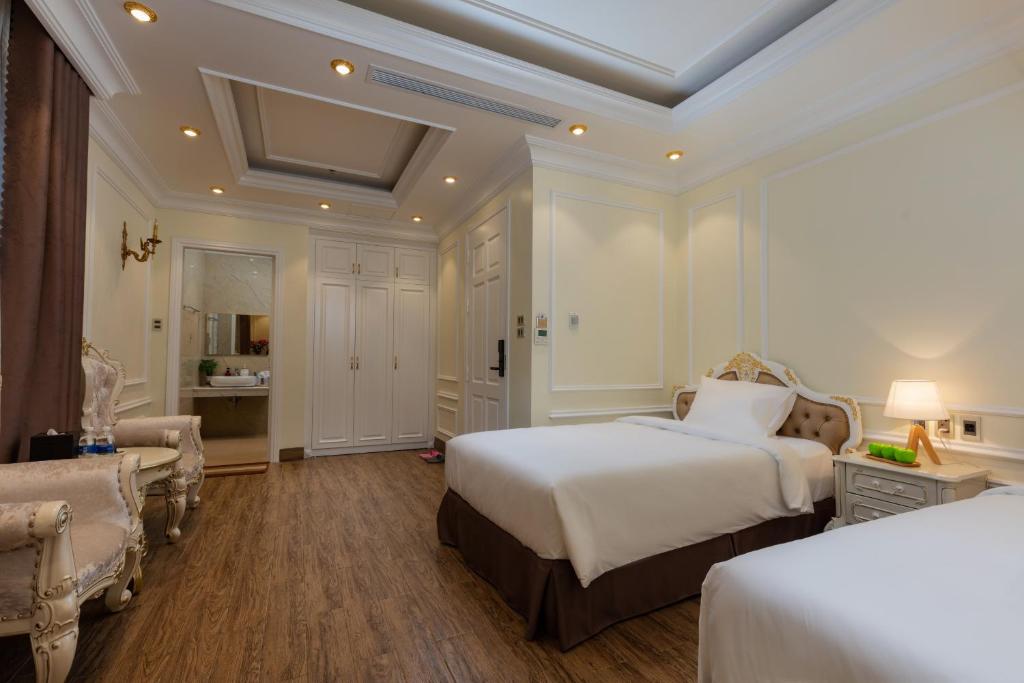 Двухместный (Двухместный номер Делюкс с 2 отдельными кроватями) отеля Cẩm Bình Hotel, Куангнинь