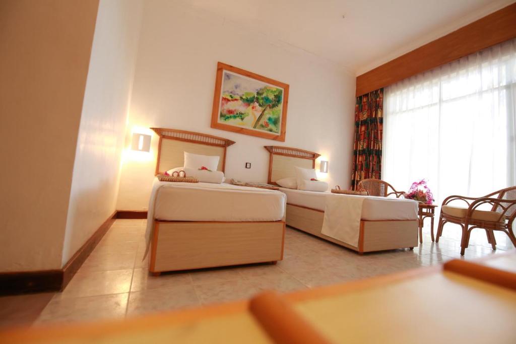 Двухместный (Двухместный номер Делюкс с 2 отдельными кроватями) отеля The Oasis Ayurveda Beach Resort, Хамбантота