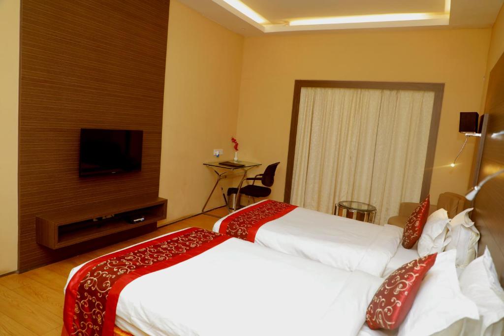 Двухместный (Двухместный номер Делюкс с 2 отдельными кроватями) отеля The Stadel, Калькутта