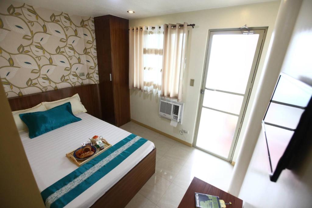 Двухместный (Стандартный двухместный номер с 1 кроватью) отеля OYO 139 Starlight Bed and Breakfast, Манила