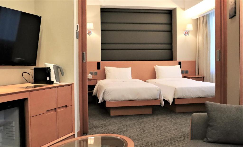 Двухместный (Grand Studio - Twin Bed with open area) отеля South Pacific Hotel, Гонконг (город)