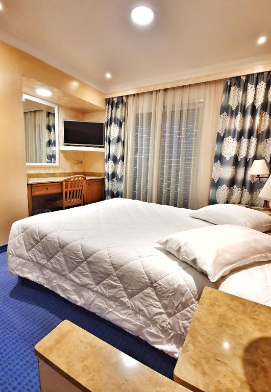 Двухместный (Двухместный номер с 1 кроватью или 2 отдельными кроватями) отеля Noufara, Пирей