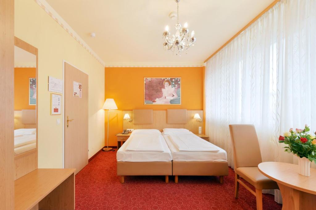 Двухместный (Улучшенный двухместный номер с 1 кроватью или 2 отдельными кроватями) отеля Gartenhotel Gabriel City, Вена