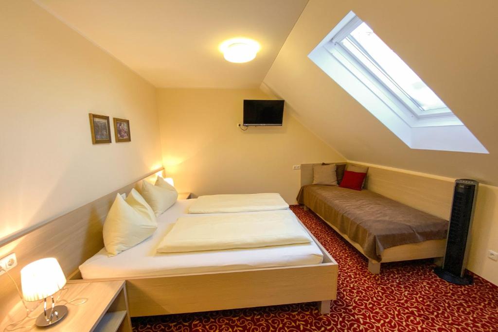 Двухместный (Двухместный номер Делюкс с 1 кроватью и дополнительной кроватью) отеля Landhotel Gasthof Bauböck, Андорф