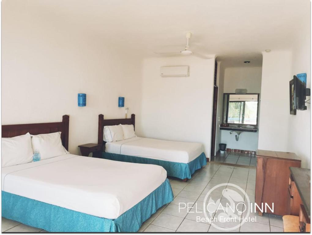 Двухместный (Двухместный номер с 2 двуспальными кроватями и видом на море) отеля Hotel Pelicano Inn Playa del Carmen, Плая-дель-Кармен