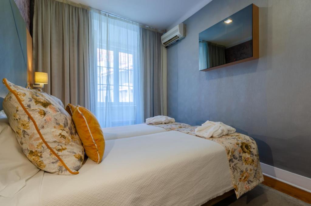 Двухместный (Улучшенный двухместный номер с 2 отдельными кроватями) отеля Hotel INN Rossio, Лиссабон
