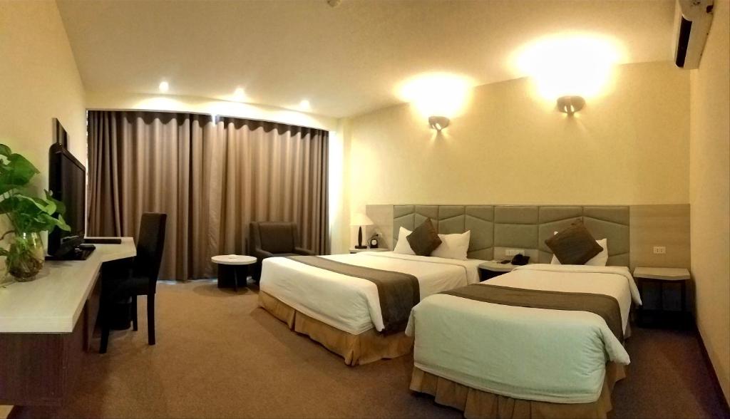 Двухместный (Улучшенный двухместный номер с 2 отдельными кроватями) отеля Muong Thanh Dien Chau Hotel, Винь