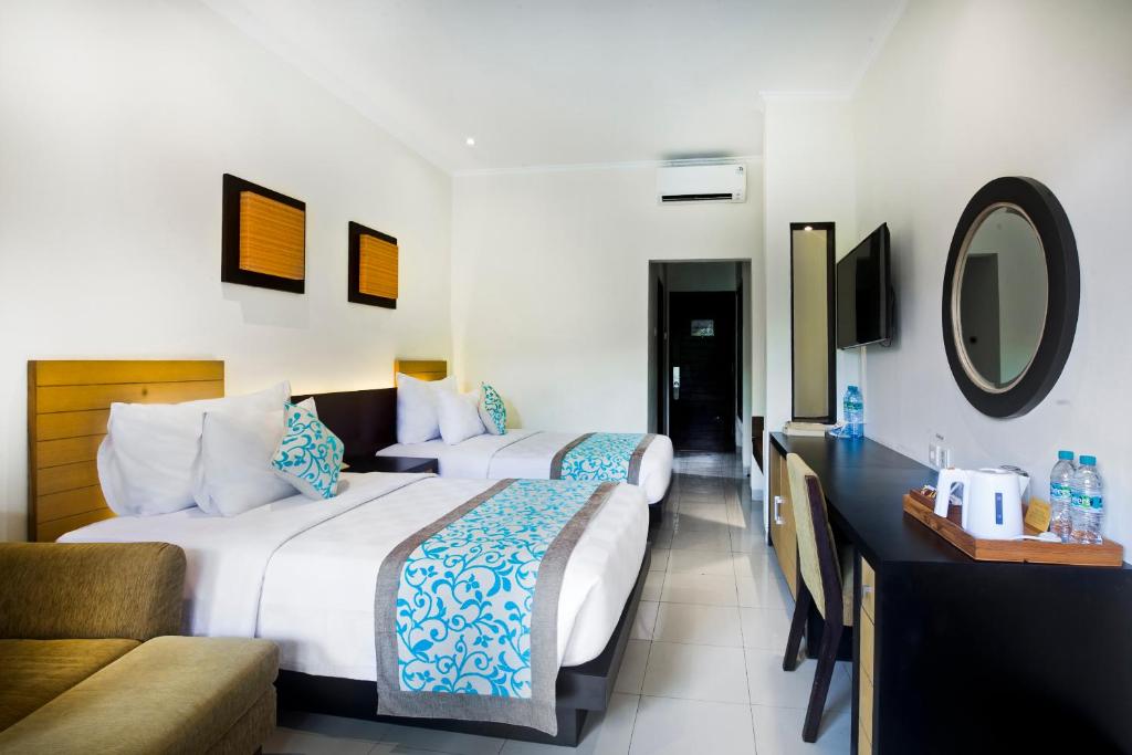 Двухместный (Двухместный номер Делюкс с 1 кроватью или 2 отдельными кроватями) отеля Adhi Jaya Hotel, Кута
