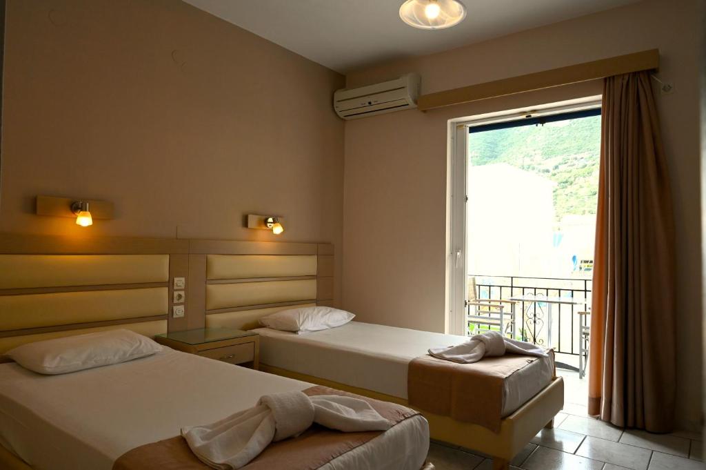 Двухместный (Двухместный номер с 1 кроватью или 2 отдельными кроватями и видом на море) отеля Surf Hotel, Василики