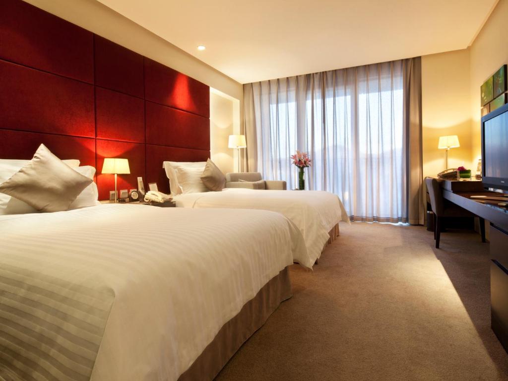 Двухместный (Двухместный номер Делюкс с 2 отдельными кроватями) отеля Howard Johnson Parkland Hotel Dalian, Далянь