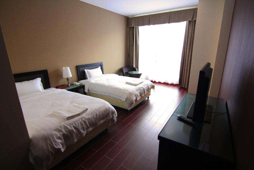 Двухместный (Двухместный номер Делюкс с 2 отдельными кроватями) отеля Putatan Platinum Hotel, Кота-Кинабалу