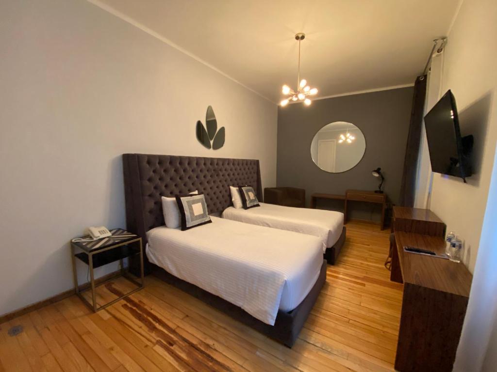 Двухместный (Стандартный двухместный номер с 2 отдельными кроватями) отеля Posada Alcazar, Мехико