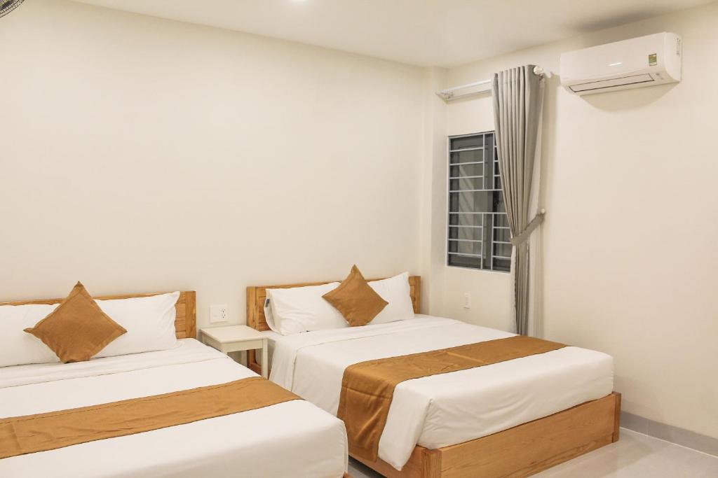 Четырехместный (Четырехместный номер с собственной ванной комнатой) апарт-отеля Anh Đào Hotel, Вунгтау