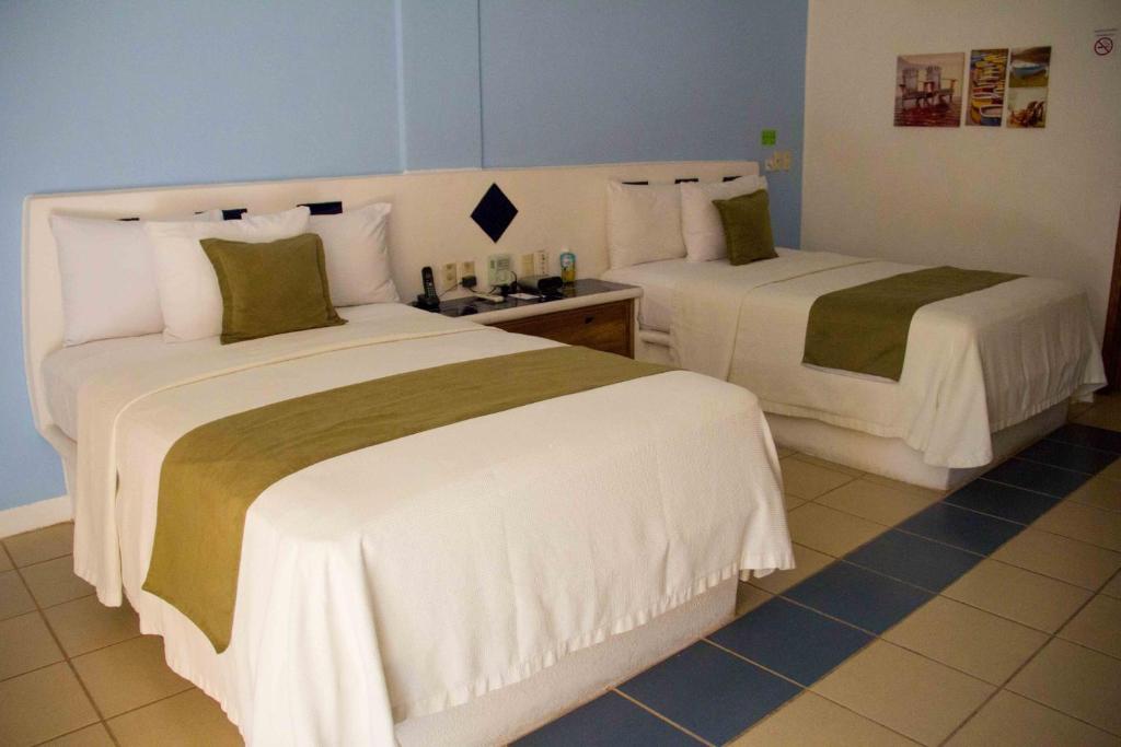 Четырехместный (Номер с 2 двуспальными кроватями - Для некурящих) отеля Best Western Posada Chahue, Санта-Крус-Хуатулко