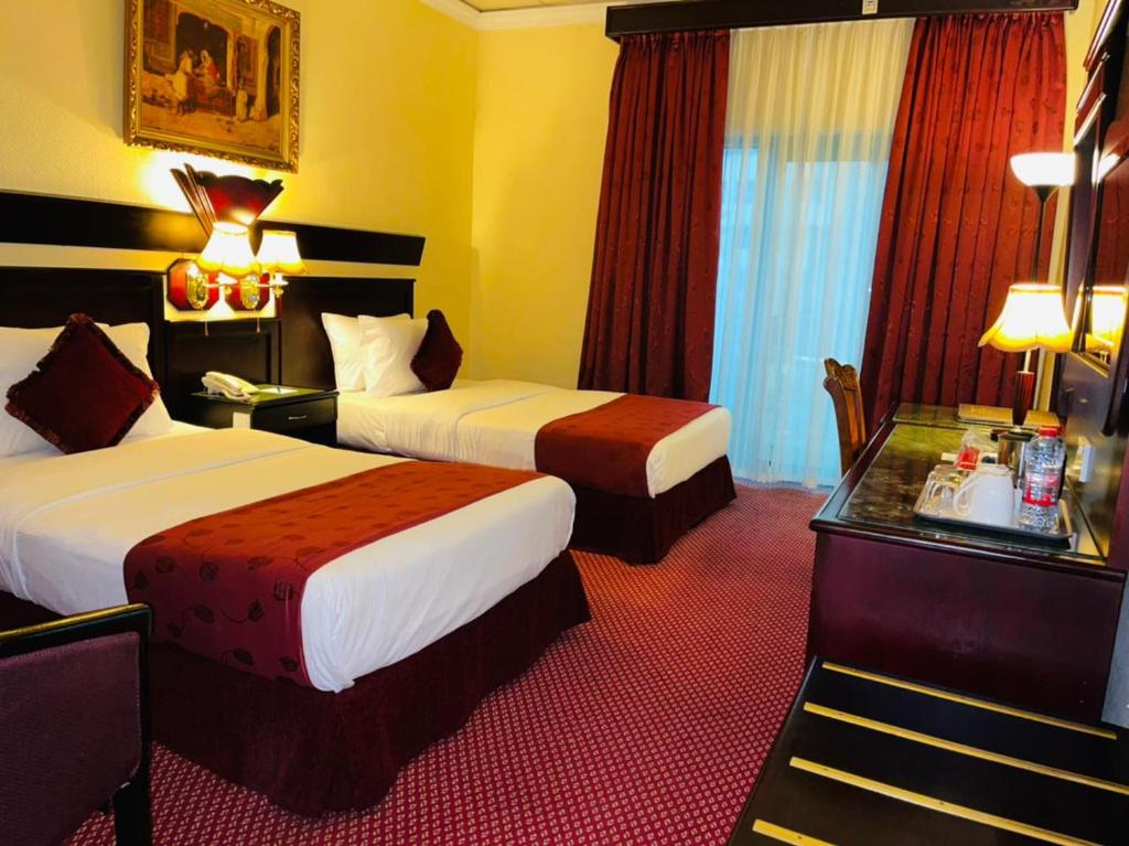 Двухместный (Стандартный двухместный номер с 2 отдельными кроватями) отеля Claridge Hotel - Dubai, Дубай