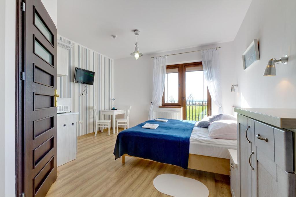 Двухместный (Двухместный номер с 2 отдельными кроватями и балконом) семейного отеля Pensjonat Riwiera, Крыница-Морска