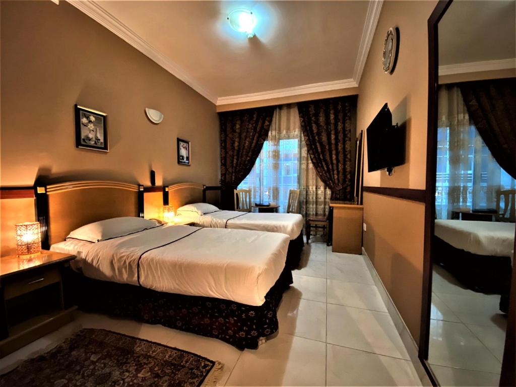 Семейный (Стандартный двухместный номер с 2 отдельными кроватями) отеля San Marco Hotel, Дубай