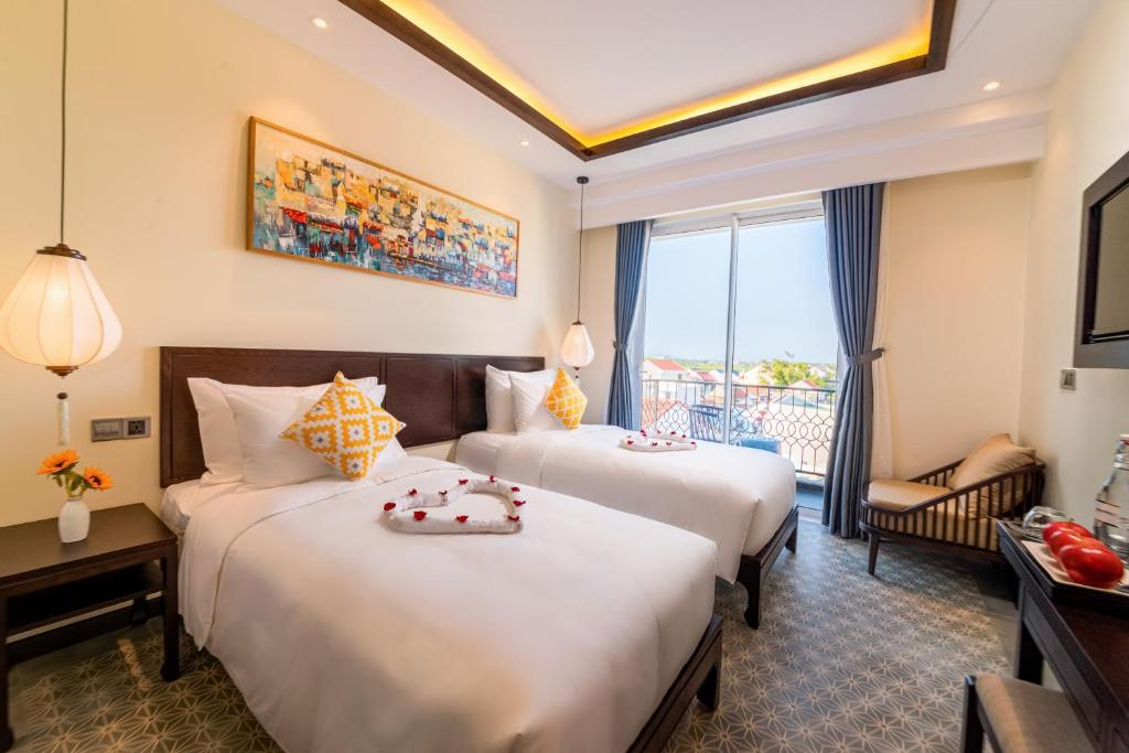 Двухместный (Deluxe Rice Paddy View with Balcony - Twin Bed) отеля Hoi An Merrily Hotel, Хойан