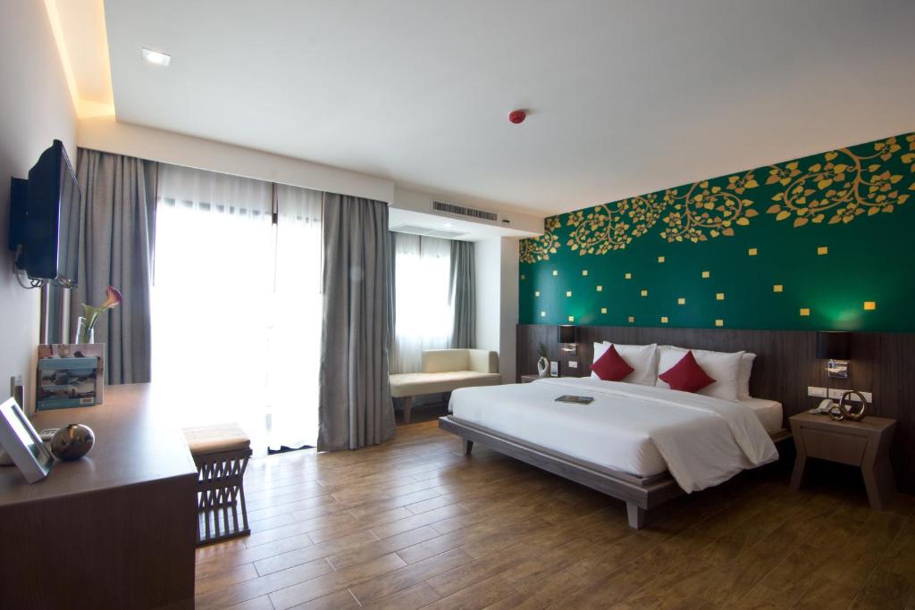 Двухместный (Улучшенный двухместный номер с 1 кроватью или 2 отдельными кроватями) отеля Tevan Jomtien Pattaya, Паттайя