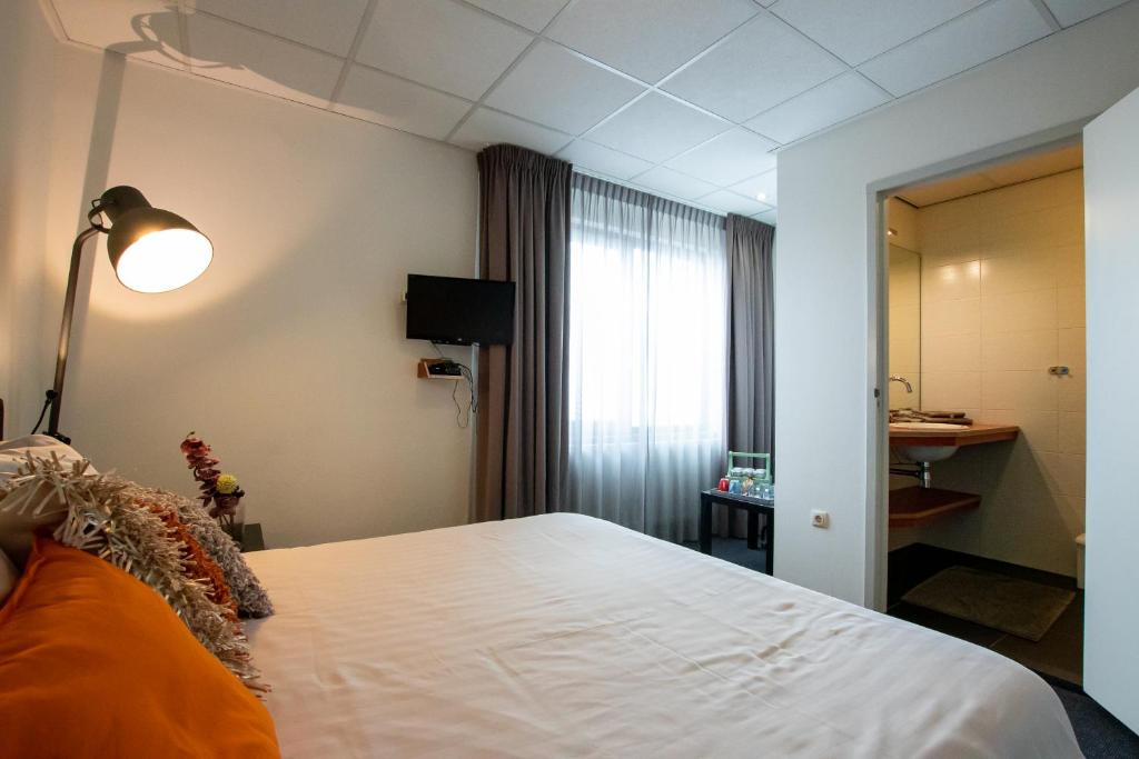 Двухместный (Двухместный номер с 2 отдельными кроватями и ванной комнатой) отеля Parkstad City Hotel, Брюнсюм