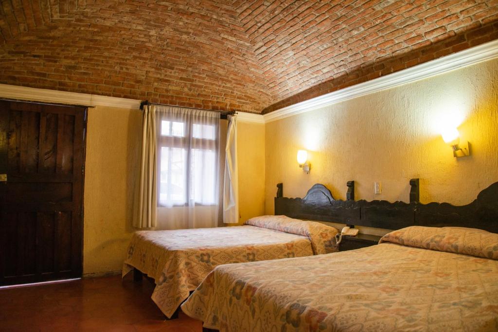 Двухместный (Двухместный номер с 2 отдельными кроватями) отеля Hotel Hacienda de Cobos, Гуанахуато