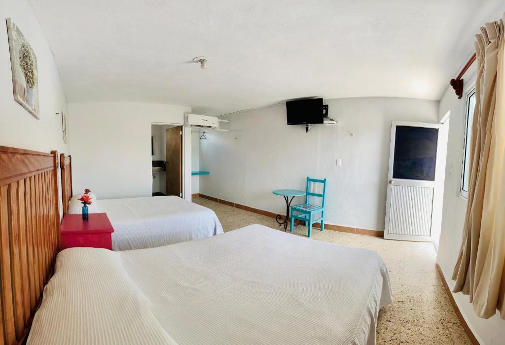 Двухместный (Двухместный номер с 2 отдельными кроватями и собственной ванной комнатой) отеля Blue Coconut Cancun, Канкун