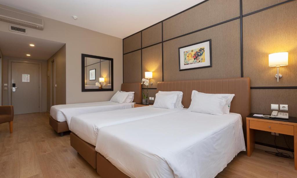 Двухместный (Стандартный двухместный номер с 1 кроватью и дополнительной кроватью) отеля Hotel Quality Inn Portus Cale, Порту