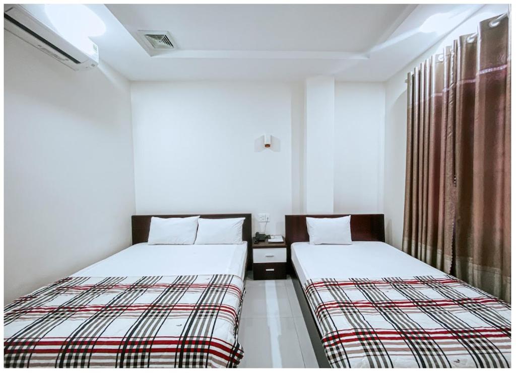 Двухместный (Двухместный номер с 2 отдельными кроватями) отеля Khách sạn Sĩ Kim, Туихоа