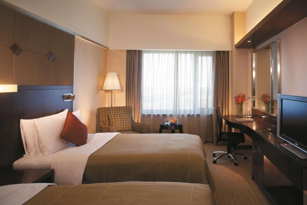 Двухместный (Улучшенный двухместный номер с 2 отдельными кроватями) отеля Shangri-La Hotel, Harbin, Харбин