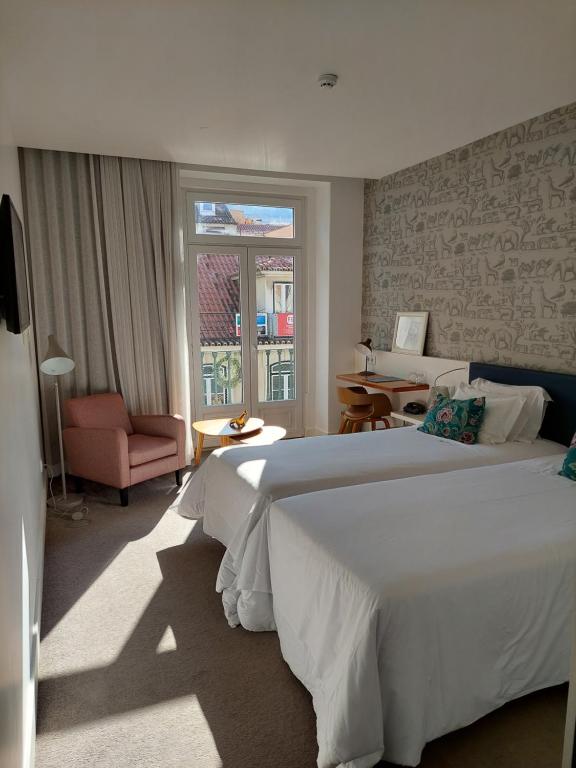 Двухместный (Двухместный номер Делюкс с 1 кроватью или 2 отдельными кроватями и балконом) отеля Augusta Boutique House, Лиссабон