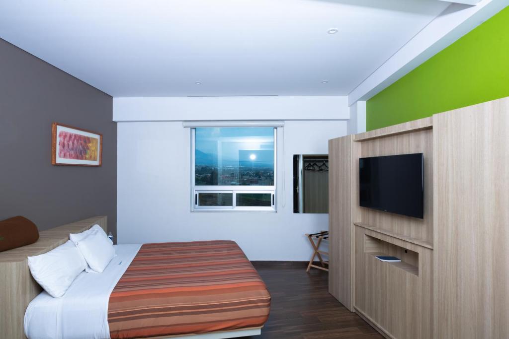 Двухместный (Улучшенный номер с кроватью размера «king-size») отеля Xcoco Inn, Теккоко-де-Мора