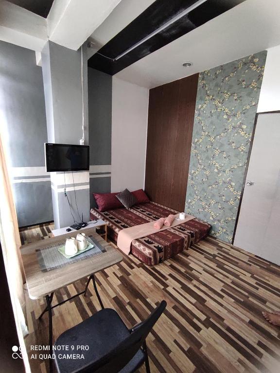 Двухместный (Двухместный номер с 1 кроватью и собственной ванной комнатой вне номера) хостела Napsule Suites, Давао