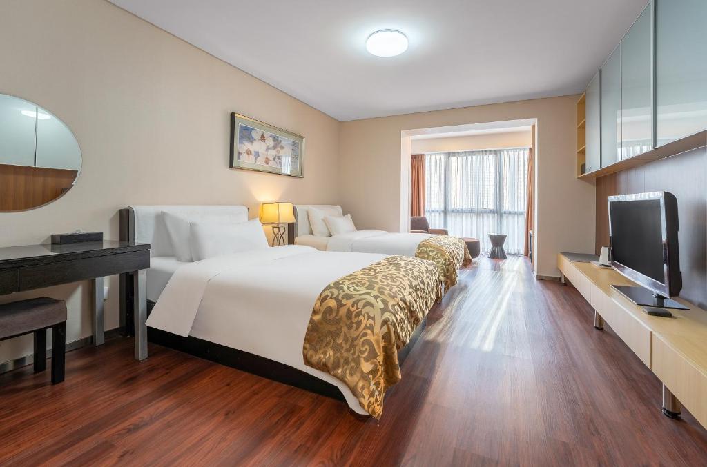 Двухместный (Бюджетный двухместный номер с 2 отдельными кроватями) отеля Qingdao Housing International Hotel, Циндао
