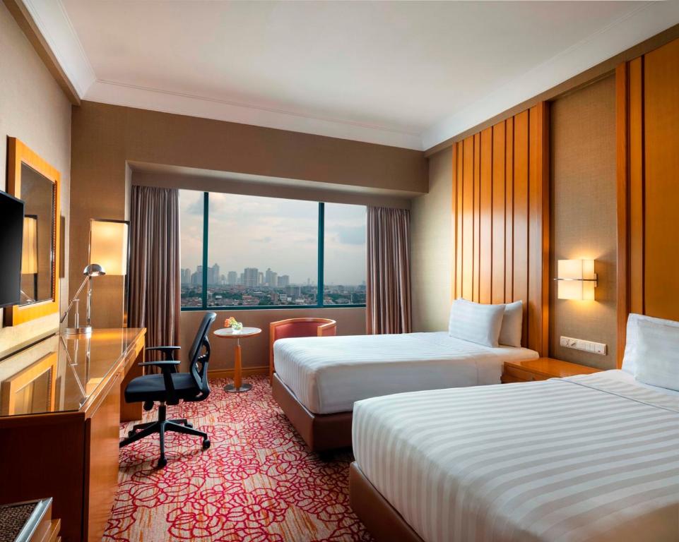 Двухместный (Двухместный номер Делюкс с 2 отдельными кроватями) отеля Hotel Ciputra Jakarta, Джакарта