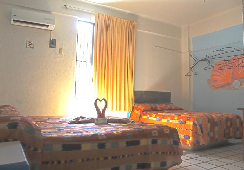 Двухместный (Стандартный двухместный номер с 2 отдельными кроватями) отеля Hotel Arrecife Huatulco Plus, Санта-Крус-Хуатулко