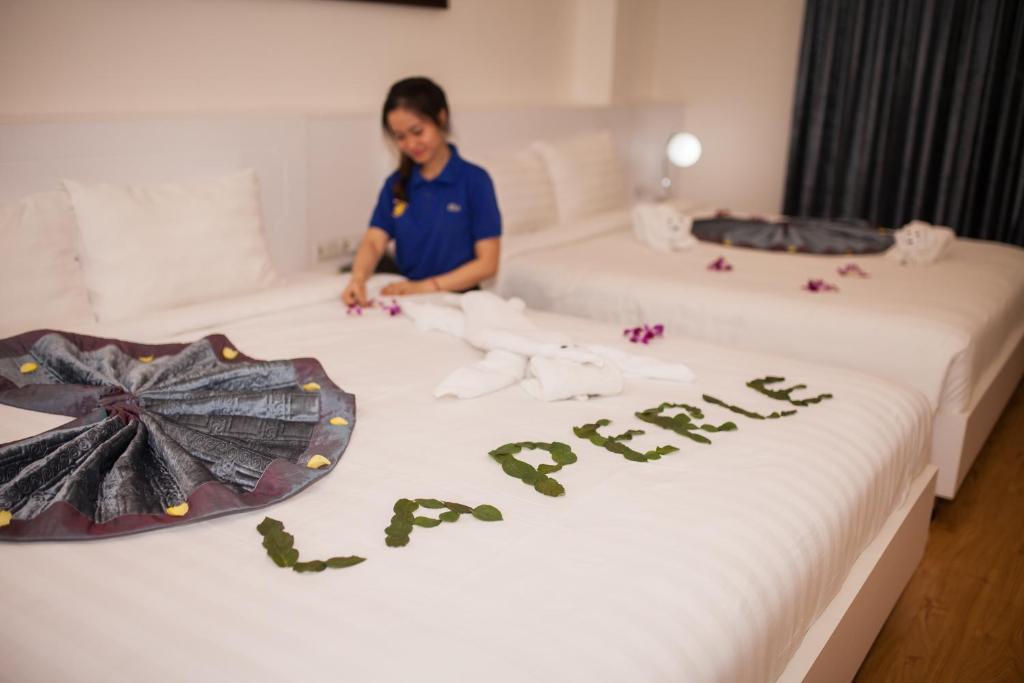 Двухместный (Двухместный номер Делюкс с 2 двуспальными кроватями) отеля Hotel La Perle, Хюэ
