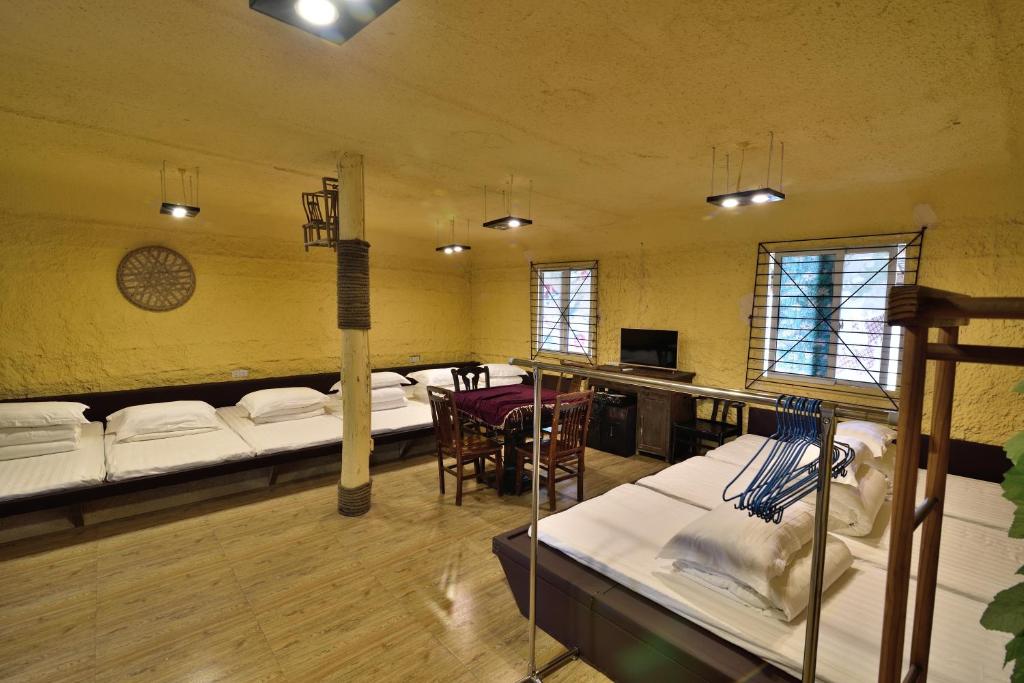 Номер (Односпальная кровать в общем номере для мужчин и женщин) загородного отеля Country Utopian Inn, Чунцин