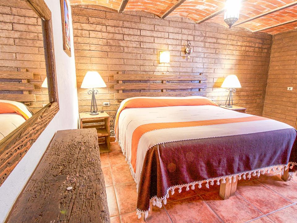 Двухместный (Двухместный номер с двуспальной кроватью и дополнительной кроватью) отеля Posada Mi Pueblito Hostal, Тапальпа