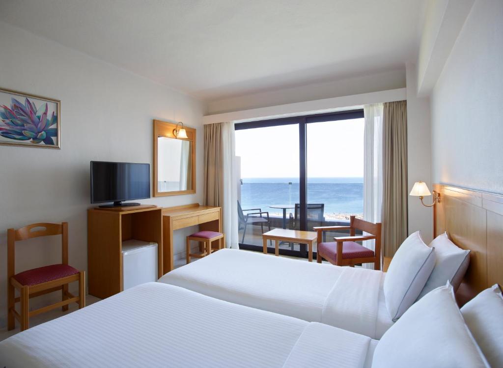 Двухместный (Двухместный номер с 1 кроватью или 2 отдельными кроватями и видом на море) отеля Cactus Hotel, Родос