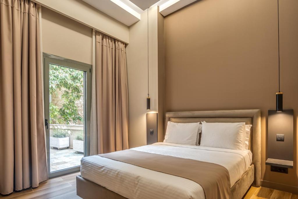 Двухместный (Улучшенный двухместный номер с 1 кроватью или 2 отдельными кроватями и видом на сад) отеля Philia Boutique Hotel, Афины