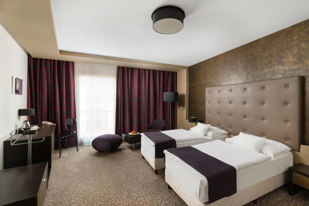 Двухместный (Улучшенный двухместный номер с 1 кроватью или 2 отдельными кроватями) отеля Corso Hotel Pécs, Печ