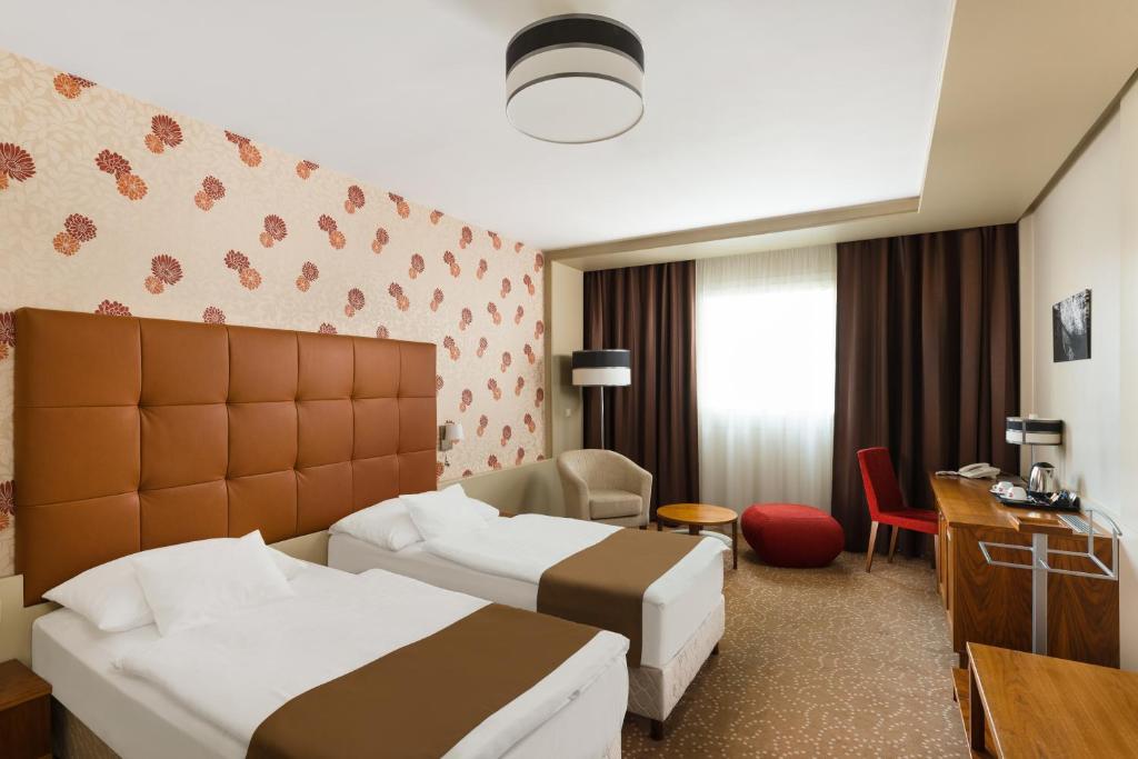 Двухместный (Стандартный двухместный номер с 1 кроватью или 2 отдельными кроватями) отеля Corso Hotel Pécs, Печ