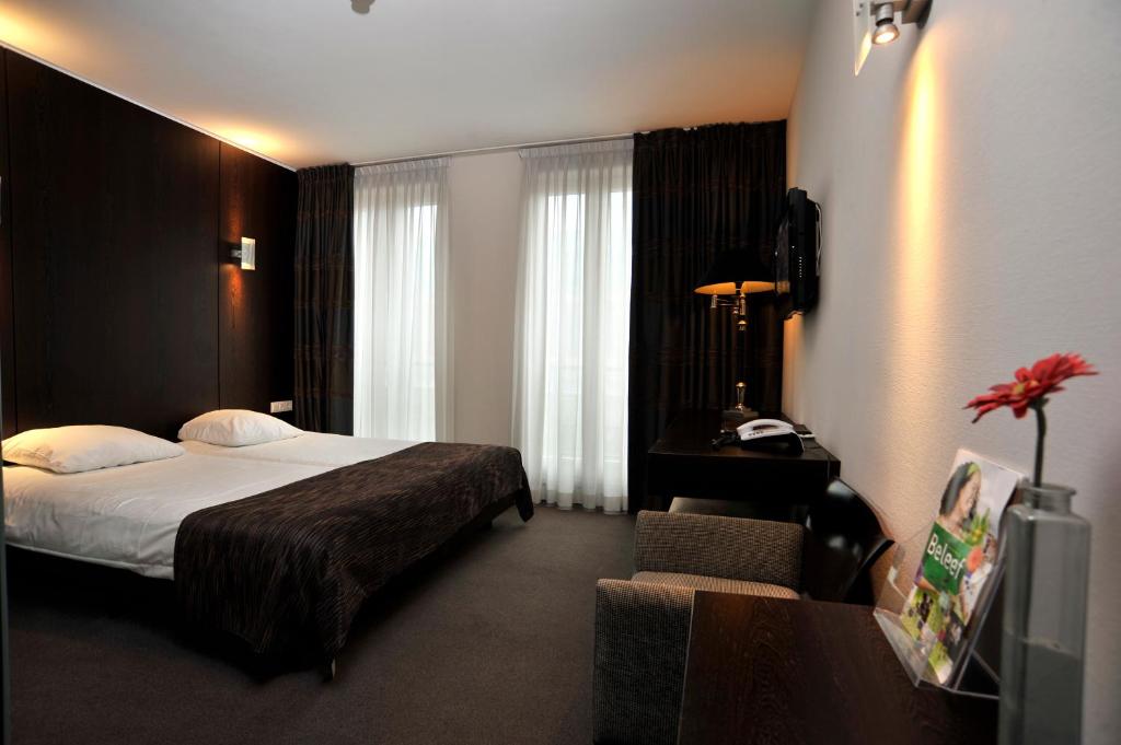 Двухместный (Двухместный номер Делюкс с 1 кроватью или 2 отдельными кроватями) отеля Golden Tulip Hotel West-Ende, Эйндховен
