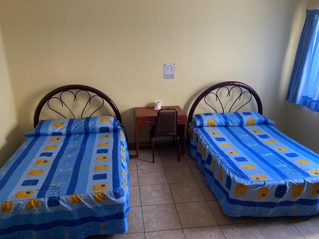 Семейный (Стандартный двухместный номер с 2 двуспальными кроватями) отеля Hotel Del Centro, Пуэбла