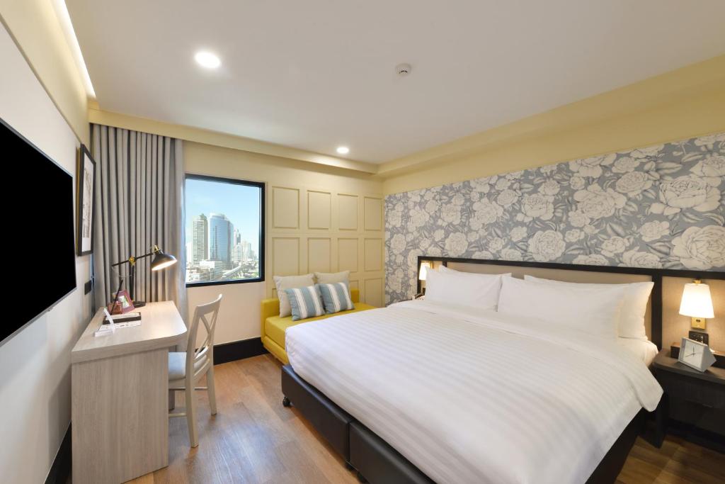 Двухместный (Улучшенный двухместный номер с 1 кроватью или 2 отдельными кроватями) отеля Astera Sathorn, Бангкок