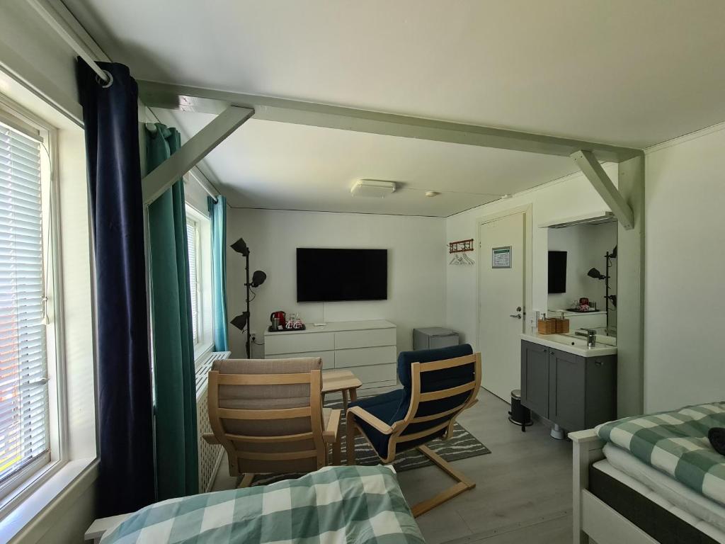 Двухместный (Стандартный двухместный номер с 2 отдельными кроватями и общей ванной комнатой) отеля Den Sovande Älgen, Маркарид