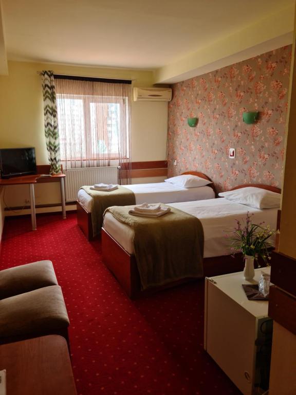 Двухместный (Двухместный номер с 2 отдельными кроватями) отеля Hotel Olimp, Клуж-Напока